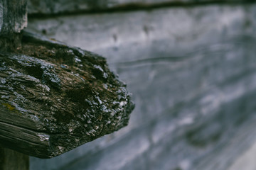 Weathered old wood texture background. Part of the wall wooden house in village in Swiss Alps. The barns, stores, stables and old houses. Timber wood wall texture background.