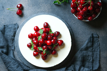 Delicious Homemade Cherry Pie with a fresh berries on dark background. Top view.