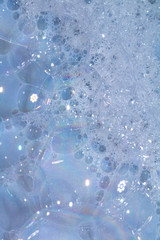 Close Up of Bath Water Bubbles Foam For Background In Blue