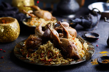 quail pilaf on the metallic plate