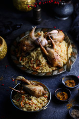 quail pilaf on the metallic plate
