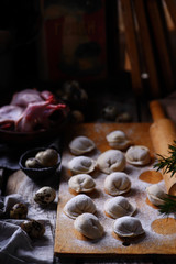 Pelmeni on wooden board.style rustic.