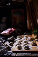 Pelmeni on wooden board.style rustic.