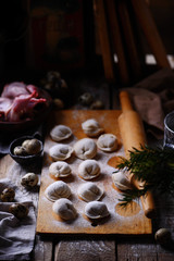 Pelmeni on wooden board.style rustic.