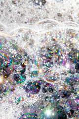 Close Up of Bath Water Bubbles Foam For Background In  Rainbows