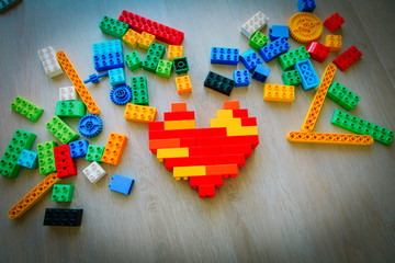 colorful plastic blocks in heart shape, enjoy playing