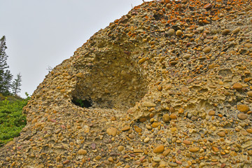 Conglomerate Cliff with lichen and Sedimentary Stone