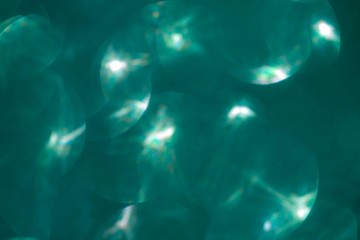 biscay turquoise green sparkles background.