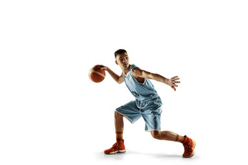 Full length portrait of young basketball player with a ball isolated on white studio background. Teenager training and practicing in action, motion. Concept of sport, movement, healthy lifestyle, ad.