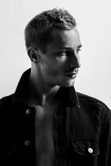 Portrait Of A Handsome Fashion Man In Black Jean Jacket