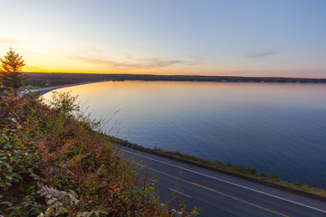 Lake Superior Sunset. Coastal highway along the Keweenaw Bay in Baraga Michigan.