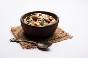 Oats Chivda / Chiwda is a healthy indian recipe with added chilli, peanuts, cashew, almond and...