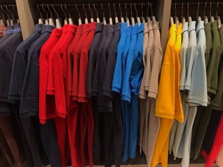 Many colors of clothes that hang in order to look beautiful and orderly.