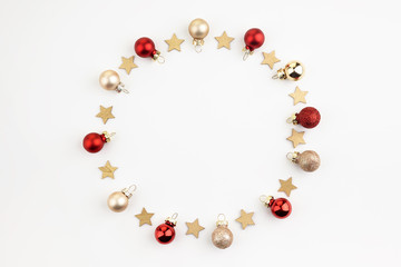 christmas or new year composition. round frame made of christmas decoration on white background. flat lay. top view