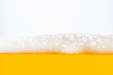 Light Beer with Bubbles and Foam Background on White. Beer Bubbles Texture Close Up