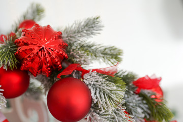 Obraz na płótnie Canvas christmas holiday card, fir branch with red decor, copy space