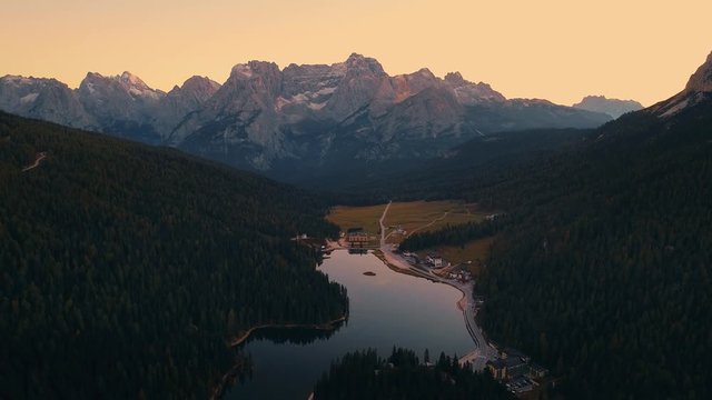 Lake aerial view at sunset 4k footage in Dolomites Italy