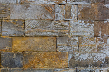 Masonry wall of old stone blocks. Background texture of a old wall