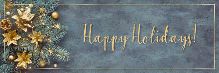 Gilded text Happy Holidays. Christmas or New Year panoramic background - fir twigs decorated with...