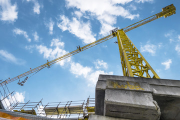 Fototapeta na wymiar Crane and building under construction