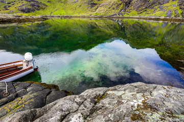 Fototapeta na wymiar Beautiful scenic landscape of amazing Scotland nature with fishing boat.