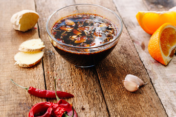 Obraz na płótnie Canvas homemade soy sauce with chili peppers