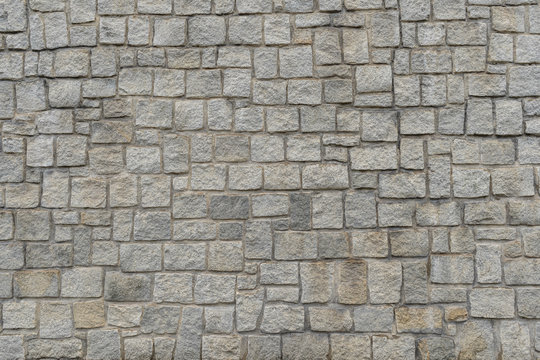 Texture of the granite stone wall for background