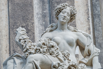 Old statue of a sensual Baroque Era naked woman in downtown of Dresden, Germany, details, closeup