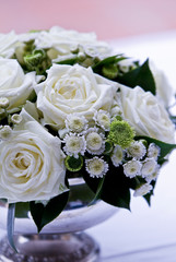 floral wedding center silver container with white roses white and green daisies.