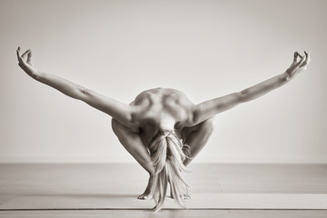Adult woman practising yoga at home