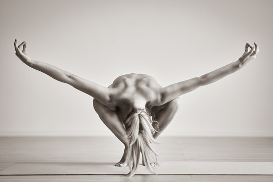 Adult Woman Practising Yoga At Home