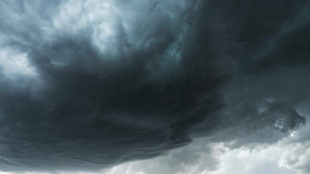Dark dramatic storm cell spinning in the sky during extreme weather warning.
