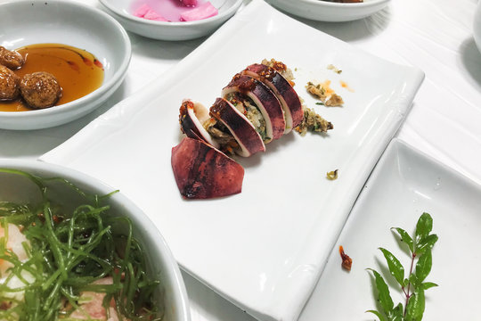 korean squid sundae - stuffed squid on plate