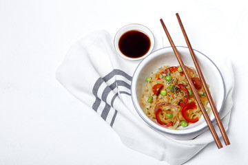 Vegan noodles with peas, peppers, onion and zucchini