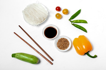 Vegan noodles with peas, peppers, onion and zucchini