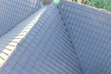 Fototapeta premium Corrugated metal roof and metal roofing. Modern roof made of met
