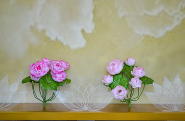 Pink lotus flowers bouquet on old concrete background 
