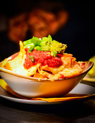 Mexican Nachos Topped with Melted Cheese & Salsa Sauce