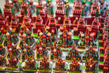 View of traditional souvenirs from Moscow, Russia, with fridge magnets with "Moscow" text, Kremlin and St. Basil Cathedral figure at local vendor souvenir shop on Red Square