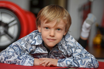 Fototapeta premium handsome charismatic teen boy in a beautiful shirt in his room