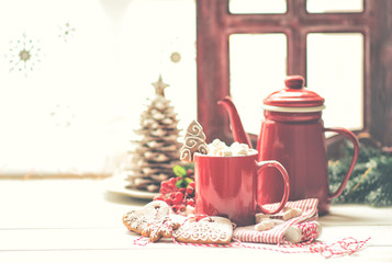 Vintage Christmas background. Christmas cup of coffee or tea on blurred, sparkling and fairy background. Christmas family dinner. Copy space for your text.