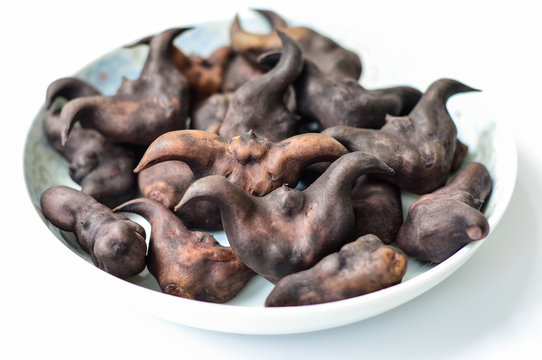 Chinese Ling Jiao, Water Caltrop in a Plate. Isolated on the White Background. 