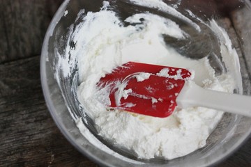 Fresh cottage cheese on a wooden table