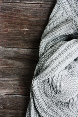 Fototapeta na wymiar Beautiful knitted grey sweater close up view 