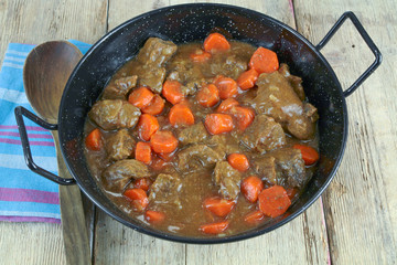 beef and carrot cooked in a dish