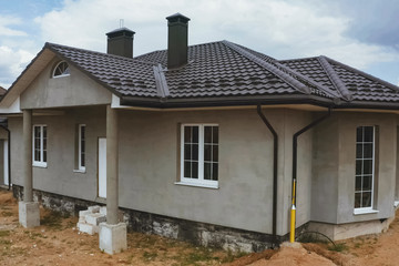 House with a brown metal roof.Corrugated metal roof and metal ro