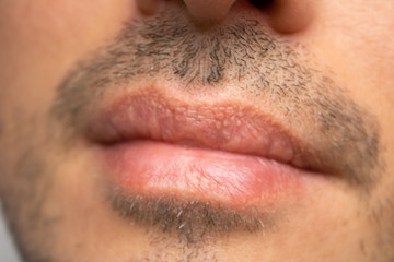 Male NU Lips. Young man closeup lips, male permanent make up, men's bristle.