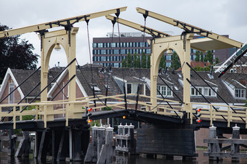 Fototapeta na wymiar Bridge over the canal in the center of Leiden, Netherlands