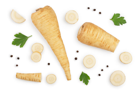 Parsnip root and slices with parsley peppercorns isolated on white background closeup. Top view. Flat lay