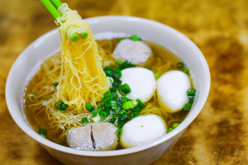 Chopsticks Pick up Hong Kong Fish Ball Noodle at Local Restaurant
